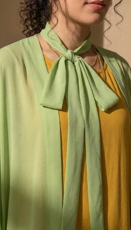 Front tie neckline detail on green modest kimono for women