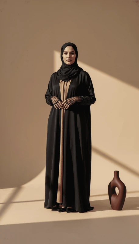 Long flowing black kimono abaya silhouette for contemporary modest wear UAE